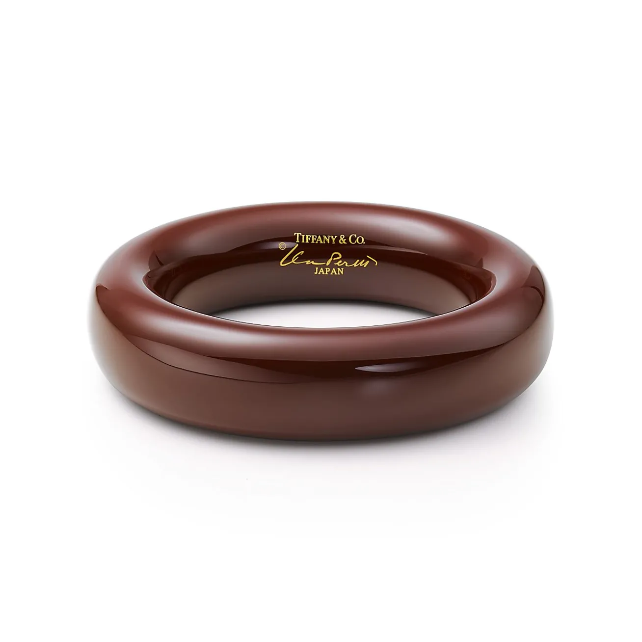 Tiffany & Co. Elsa Peretti® bangle in brown lacquer over Japanese hardwood, medium. | ^ Elsa Peretti®