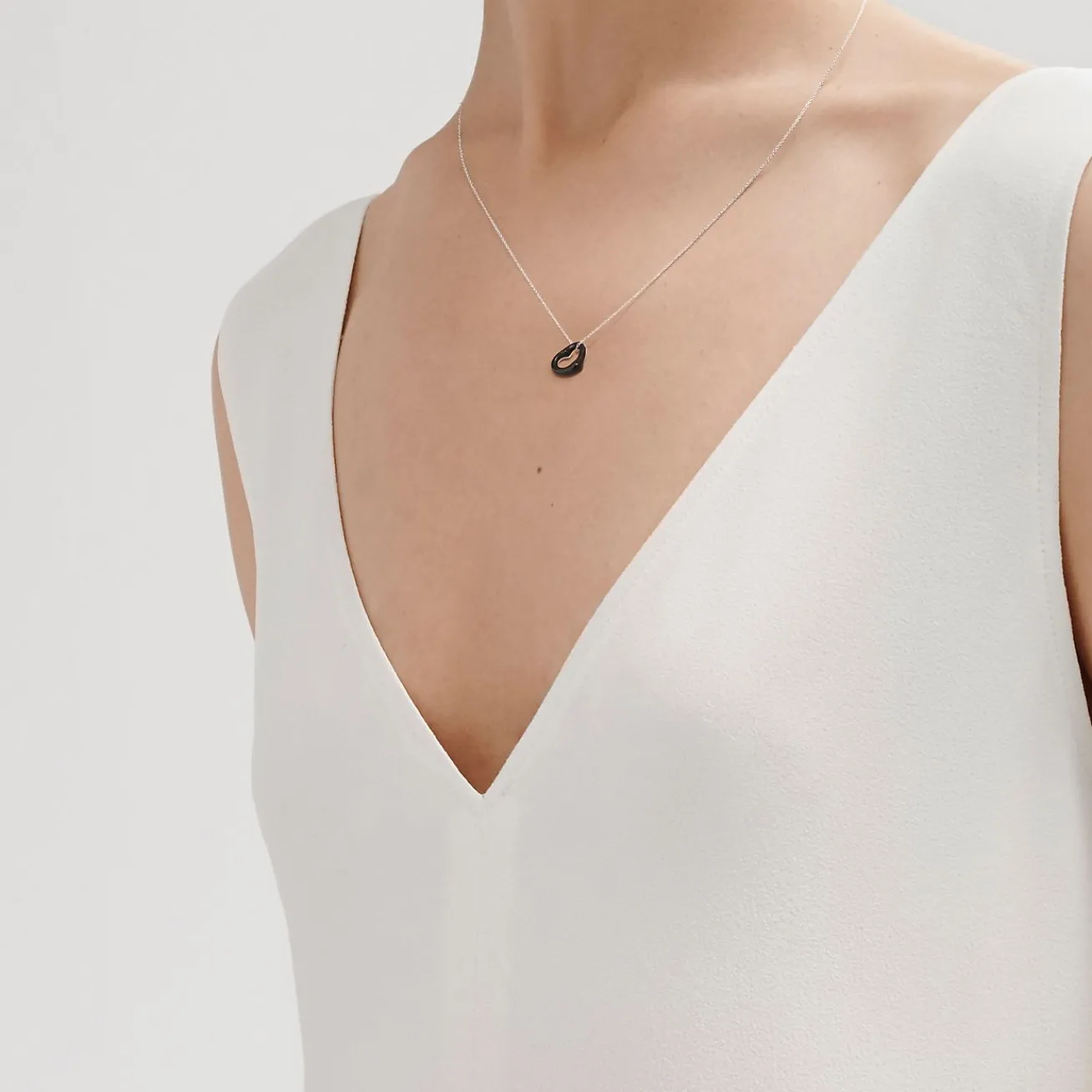 Tiffany & Co. Elsa Peretti® Open Heart pendant of black jade and sterling silver. | ^ Necklaces & Pendants|Sterling Silver Jewelry