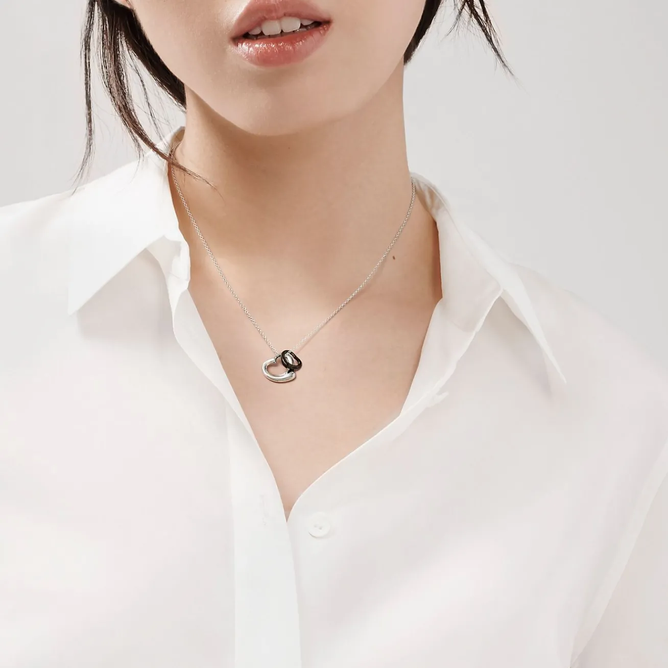Tiffany & Co. Elsa Peretti® Open Heart pendant in sterling silver and black jade. | ^ Necklaces & Pendants|Sterling Silver Jewelry