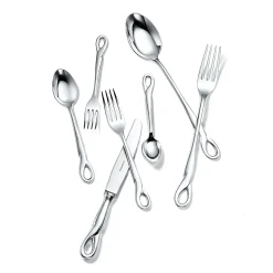 Tiffany & Co. Elsa Peretti® Padova™ 32-piece flatware set in sterling silver. | ^ Elsa Peretti®|The Couple