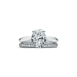 Tiffany & Co. Oval-cut diamond engagement ring in platinum. | ^ Engagement Rings
