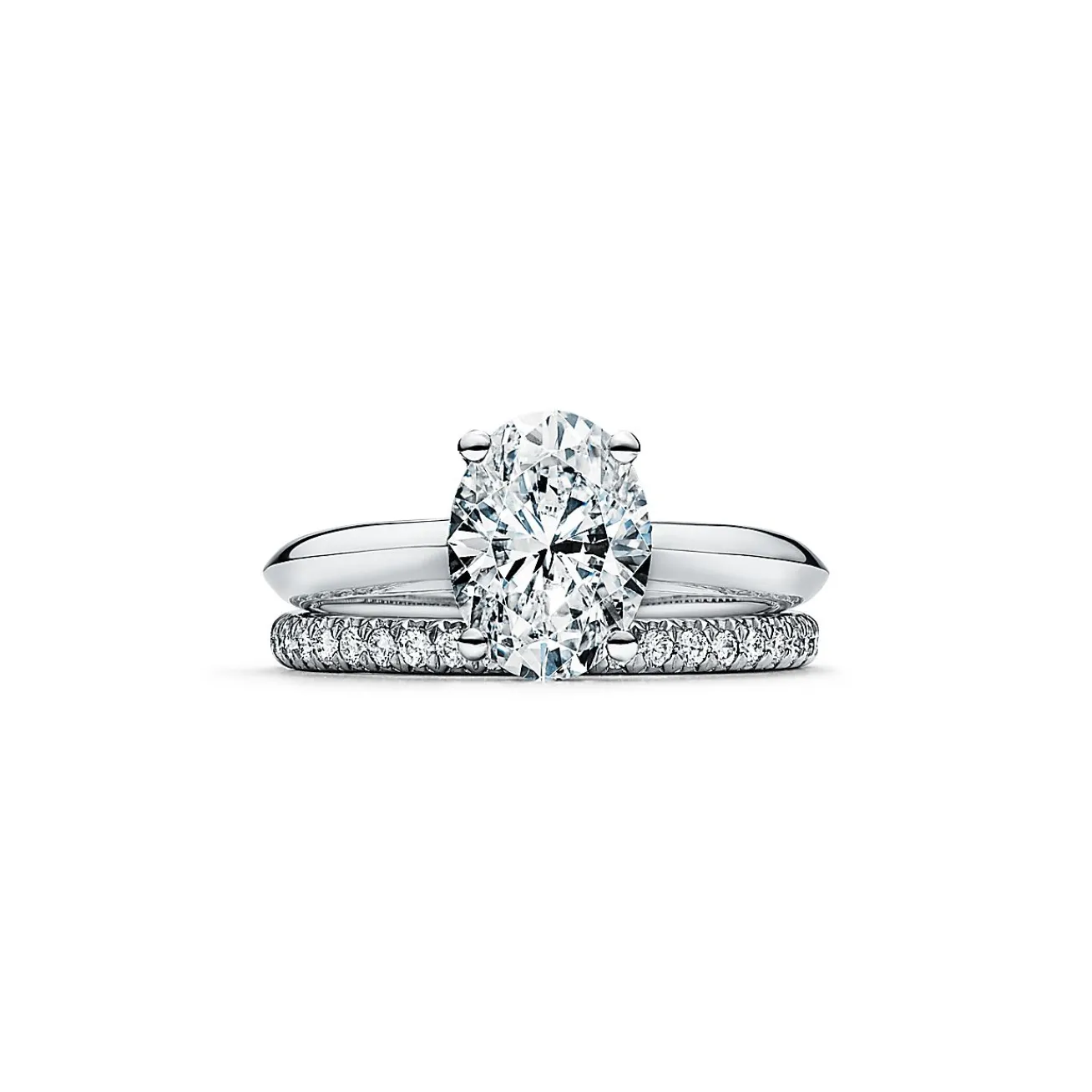 Tiffany & Co. Oval-cut diamond engagement ring in platinum. | ^ Engagement Rings