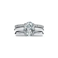 Tiffany & Co. Oval-cut diamond engagement ring in platinum. | ^ Engagement Rings