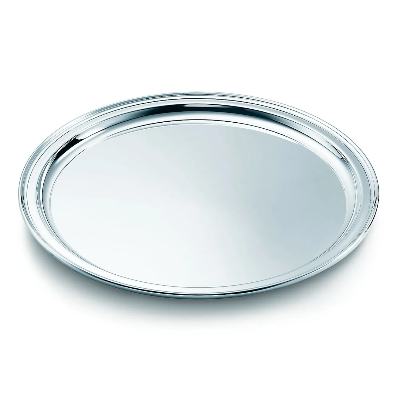 Tiffany & Co. Regency round tray in sterling silver. | ^ Tableware|Flatware & Trays