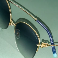 Tiffany & Co. Tiffany HardWear Sunglasses in Pale Gold-colored Metal with Blue Lenses | ^ Tiffany HardWear|Sunglasses