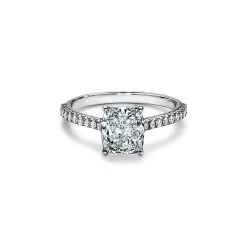 Tiffany & Co. Tiffany Novo® cushion-cut engagement ring with a pavé diamond band in platinum. | ^ Engagement Rings