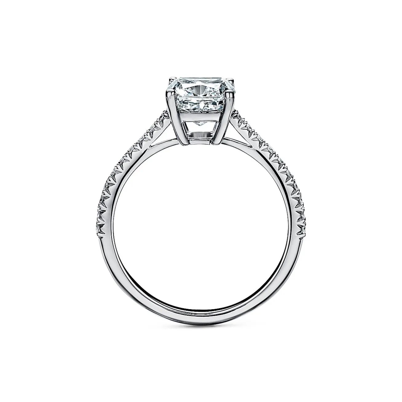 Tiffany & Co. Tiffany Novo® cushion-cut engagement ring with a pavé diamond band in platinum. | ^ Engagement Rings