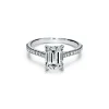 Tiffany & Co. Tiffany Novo® emerald-cut engagement ring with a pavé diamond band in platinum. | ^ Engagement Rings