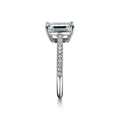 Tiffany & Co. Tiffany Novo® emerald-cut engagement ring with a pavé diamond band in platinum. | ^ Engagement Rings
