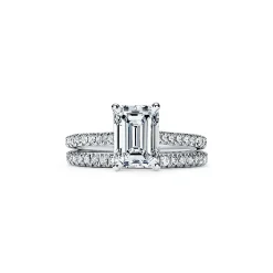 Tiffany & Co. Tiffany Novo® emerald-cut engagement ring with a pavé diamond band in platinum. | ^ Engagement Rings