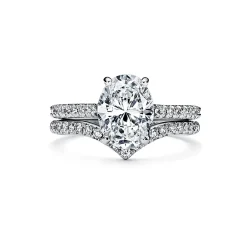 Tiffany & Co. Tiffany Novo® oval brilliant engagement ring with a pavé diamond platinum band. | ^ Engagement Rings