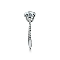 Tiffany & Co. Tiffany Novo® round brilliant engagement ring with a pavé diamond platinum band. | ^ Engagement Rings