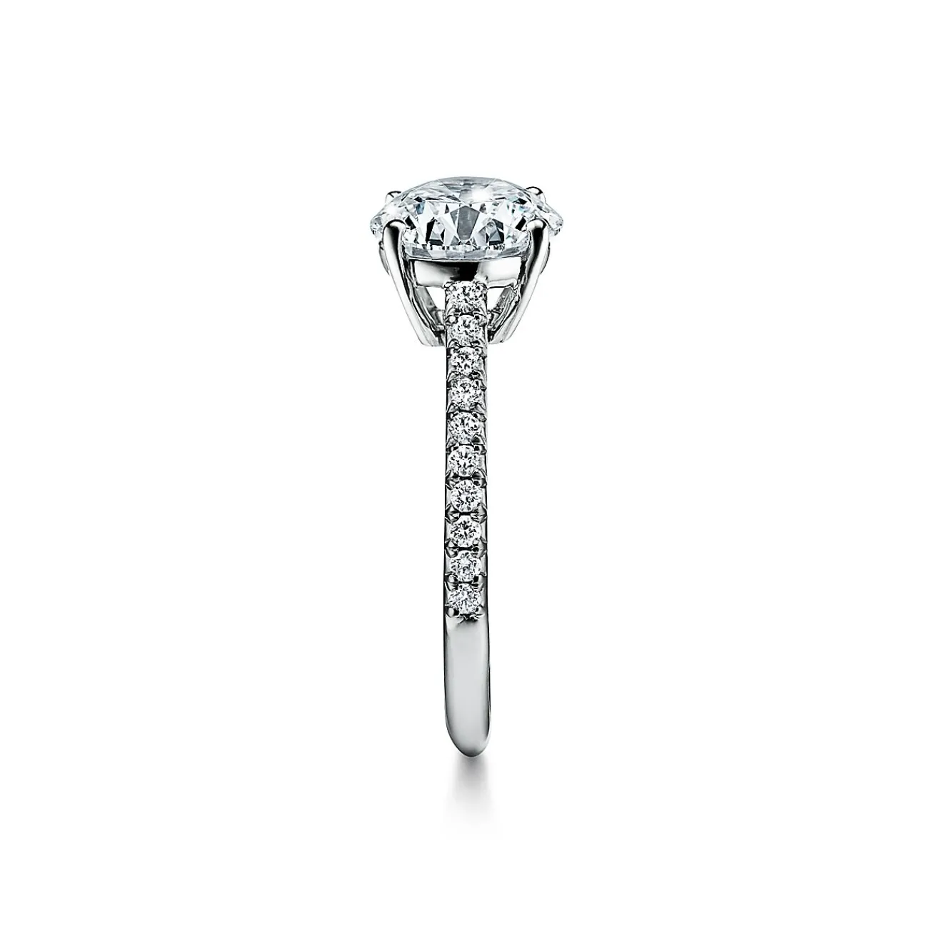 Tiffany & Co. Tiffany Novo® round brilliant engagement ring with a pavé diamond platinum band. | ^ Engagement Rings