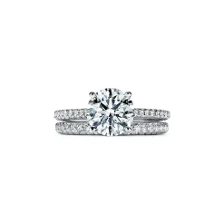 Tiffany & Co. Tiffany Novo® round brilliant engagement ring with a pavé diamond platinum band. | ^ Engagement Rings