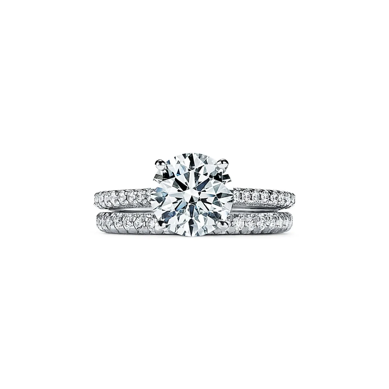 Tiffany & Co. Tiffany Novo® round brilliant engagement ring with a pavé diamond platinum band. | ^ Engagement Rings