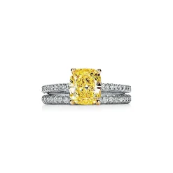 Tiffany & Co. Tiffany Novo® yellow diamond engagement ring with a pavé diamond platinum band. | ^ Engagement Rings