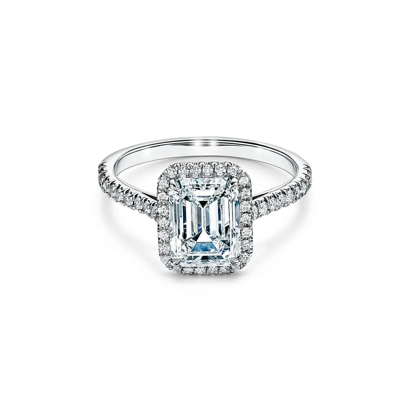 Tiffany & Co. Tiffany Soleste® emerald-cut halo engagement ring with a diamond platinum band. | ^ Engagement Rings