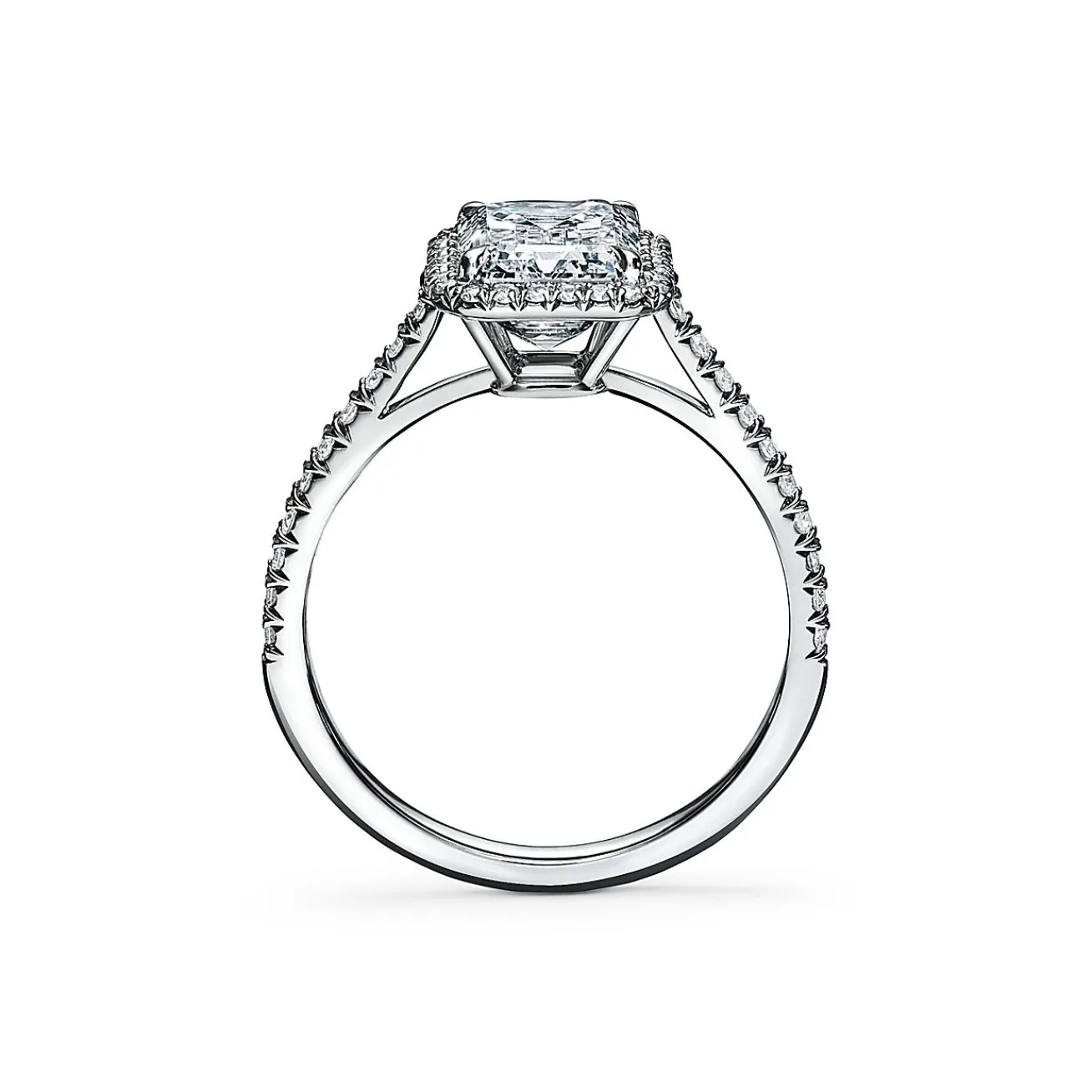 Tiffany & Co. Tiffany Soleste® emerald-cut halo engagement ring with a diamond platinum band. | ^ Engagement Rings