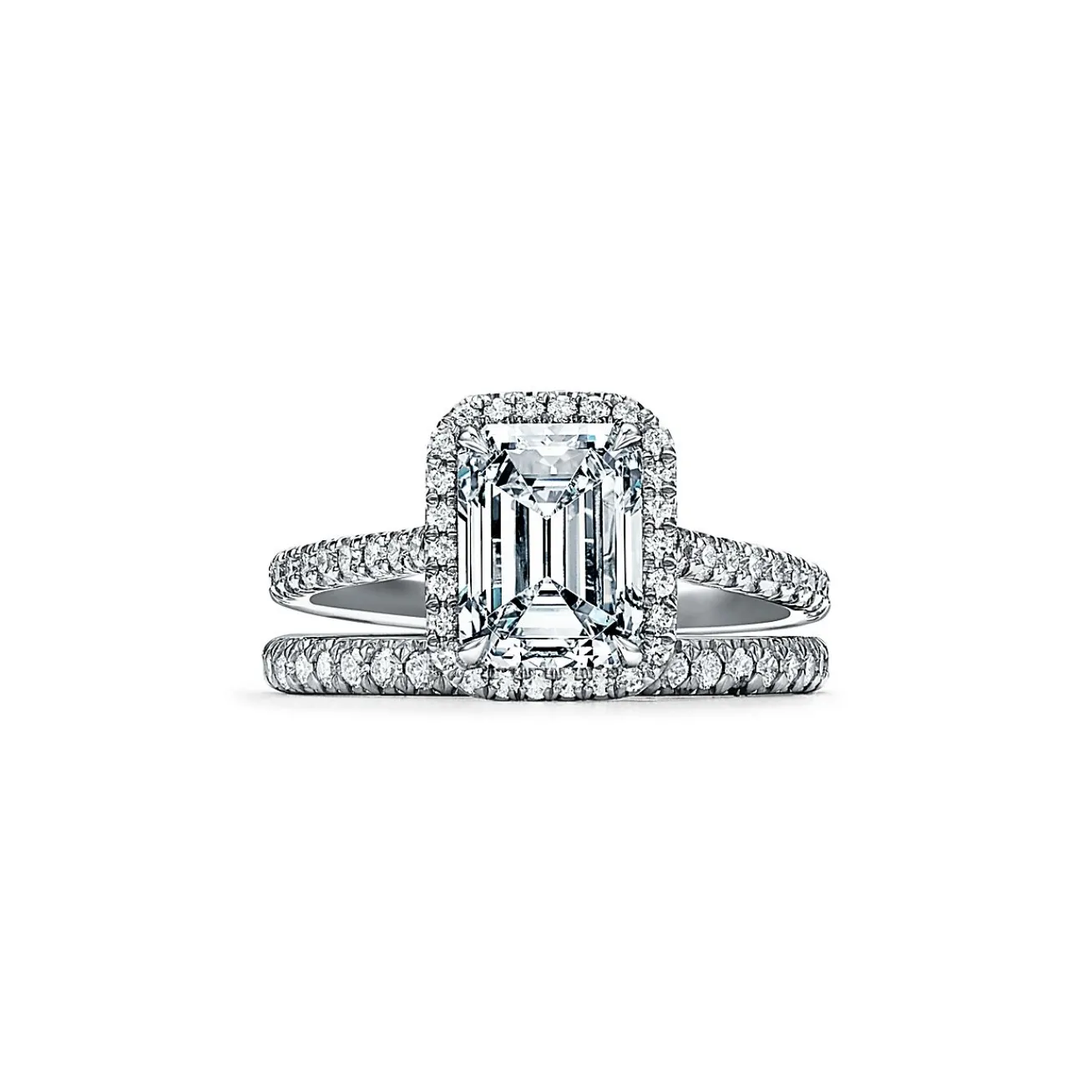 Tiffany & Co. Tiffany Soleste® emerald-cut halo engagement ring with a diamond platinum band. | ^ Engagement Rings