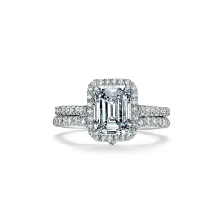 Tiffany & Co. Tiffany Soleste® emerald-cut halo engagement ring with a diamond platinum band. | ^ Engagement Rings