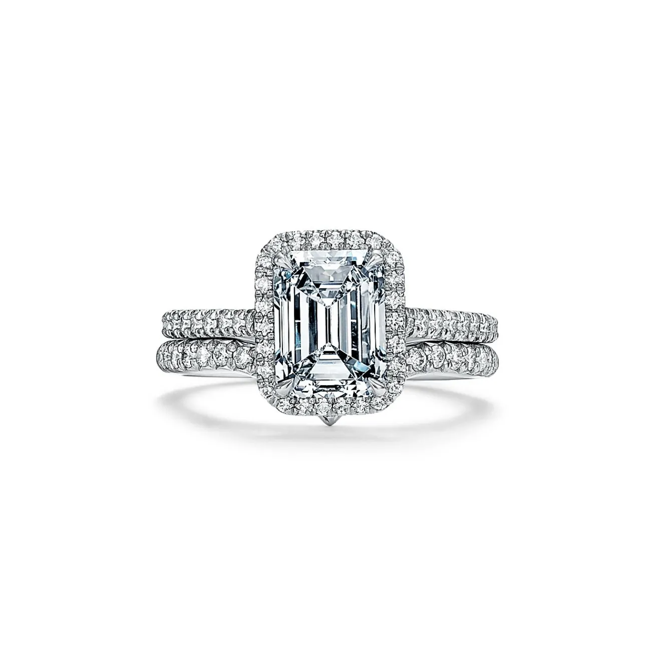 Tiffany & Co. Tiffany Soleste® emerald-cut halo engagement ring with a diamond platinum band. | ^ Engagement Rings