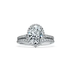 Tiffany & Co. Tiffany Soleste® oval halo engagement ring with a diamond band in platinum. | ^ Engagement Rings