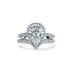 Tiffany & Co. Tiffany Soleste® pear-shaped halo engagement ring with a diamond platinum band. | ^ Engagement Rings