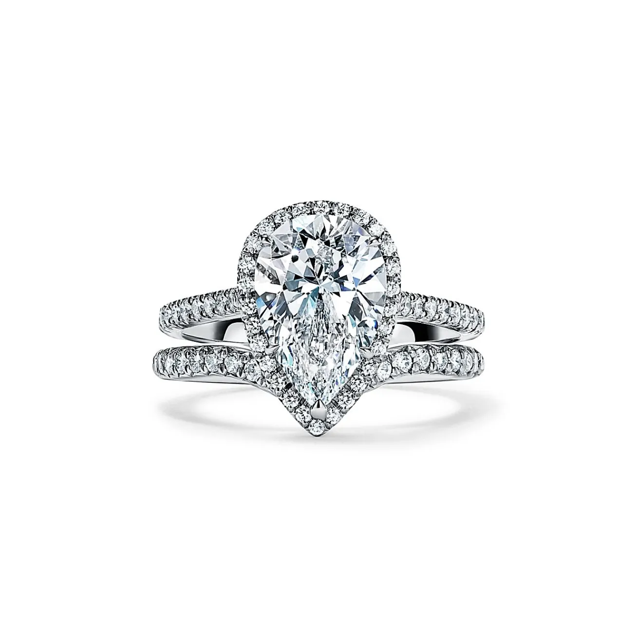 Tiffany & Co. Tiffany Soleste® pear-shaped halo engagement ring with a diamond platinum band. | ^ Engagement Rings