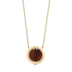 Tiffany & Co. Tiffany T diamond and tiger's eye circle pendant in 18k gold. | ^ Necklaces & Pendants|Gold Jewelry