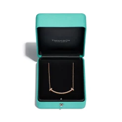 Tiffany & Co. Tiffany T medium smile pendant in 18k rose gold with diamonds. | ^ Necklaces & Pendants|Rose Gold Jewelry