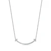 Tiffany & Co. Tiffany T medium smile pendant in 18k white gold with diamonds. | ^ Necklaces & Pendants|Gifts for Her