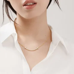 Tiffany & Co. Tiffany T medium smile pendant in 18k gold with diamonds. | ^ Necklaces & Pendants|Gold Jewelry