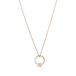 Tiffany & Co. Tiffany T pendant in 18k rose gold with a baguette diamond. | ^ Necklaces & Pendants|Men's Jewelry