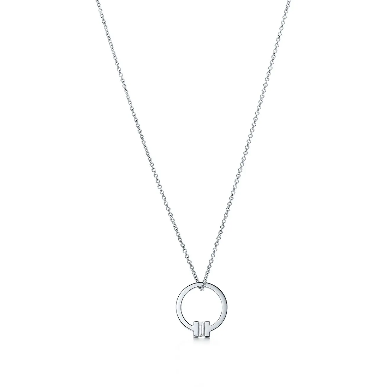 Tiffany & Co. Tiffany T pendant in 18k white gold with a baguette diamond. | ^ Necklaces & Pendants|Men's Jewelry