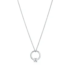Tiffany & Co. Tiffany T pendant in 18k white gold with a baguette diamond. | ^ Necklaces & Pendants|Men's Jewelry