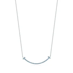 Tiffany & Co. Tiffany T smile pendant in 18k white gold with blue topazes, small. | ^ Necklaces & Pendants|Colored Gemstone Jewelry