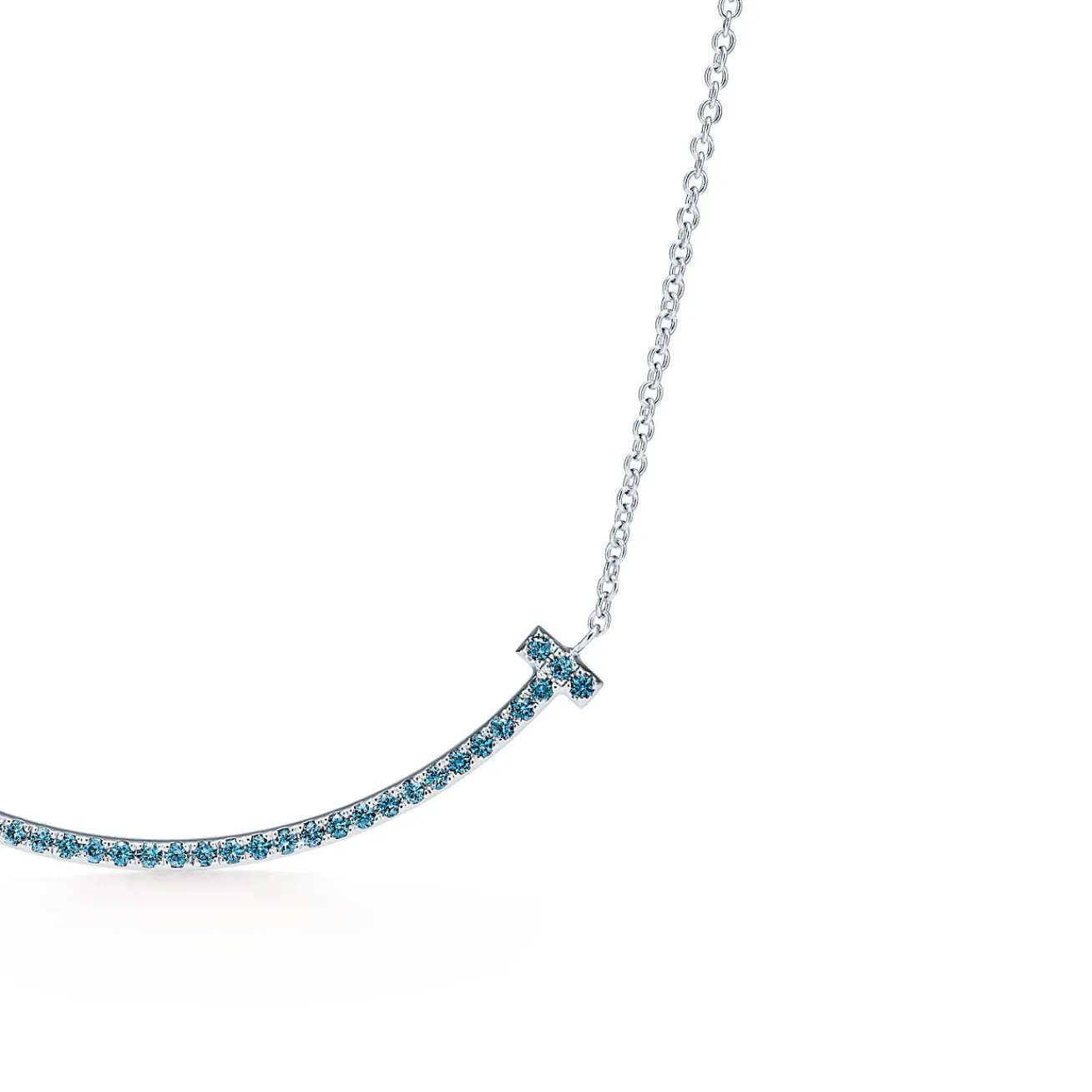Tiffany & Co. Tiffany T smile pendant in 18k white gold with blue topazes, small. | ^ Necklaces & Pendants|Colored Gemstone Jewelry