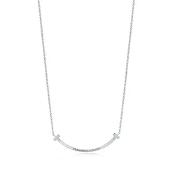 Tiffany & Co. Tiffany T smile pendant in 18k white gold with rubies, small. | ^ Necklaces & Pendants|Colored Gemstone Jewelry