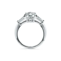 Tiffany & Co. Tiffany Three Stone engagement ring with baguette side stones in platinum. | ^ Engagement Rings