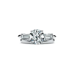 Tiffany & Co. Tiffany Three Stone engagement ring with baguette side stones in platinum. | ^ Engagement Rings