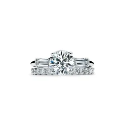 Tiffany & Co. Tiffany Three Stone engagement ring with baguette side stones in platinum. | ^ Engagement Rings