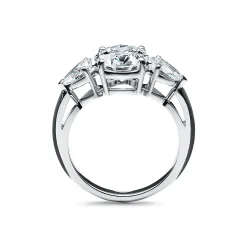 Tiffany & Co. Tiffany Three Stone engagement ring with pear-shaped side stones in platinum. | ^ Engagement Rings