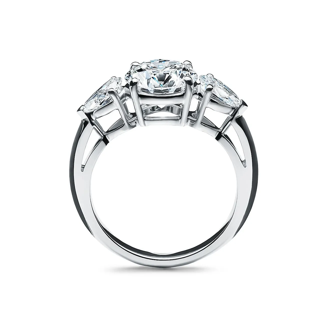 Tiffany & Co. Tiffany Three Stone engagement ring with pear-shaped side stones in platinum. | ^ Engagement Rings