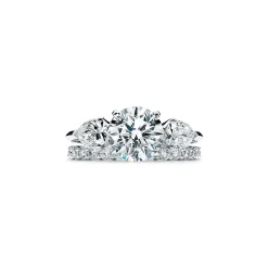 Tiffany & Co. Tiffany Three Stone engagement ring with pear-shaped side stones in platinum. | ^ Engagement Rings