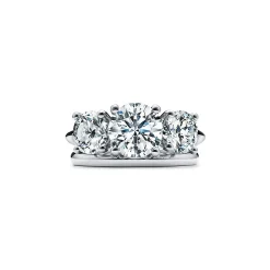 Tiffany & Co. Tiffany Three Stone engagement ring in platinum: an expression of eternal love. | ^ Engagement Rings