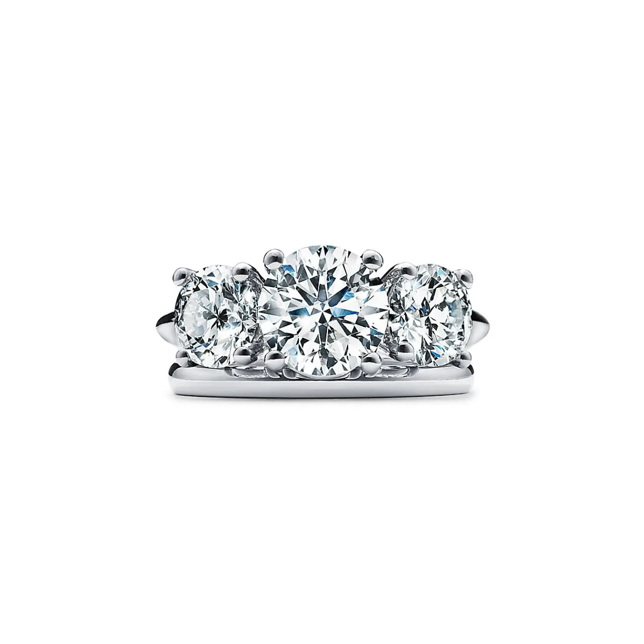 Tiffany & Co. Tiffany Three Stone engagement ring in platinum: an expression of eternal love. | ^ Engagement Rings