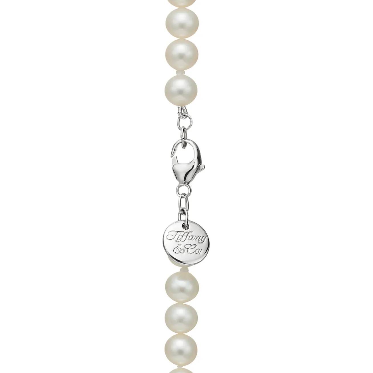 Tiffany & Co. Ziegfeld Collection pearl necklace with a silver clasp and decorative tag, 8-9 mm. | ^ Necklaces & Pendants